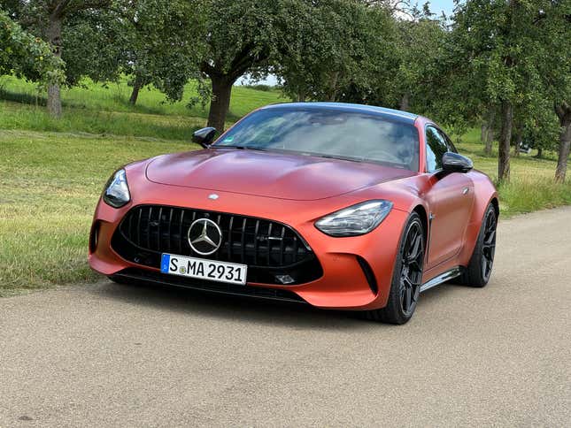 Front 3/4 view of a matte orange 2025 Mercedes-AMG GT63 S E Performance