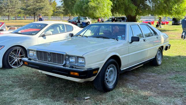 Front 3/4 view of a yellow Maserati Quattroporte III