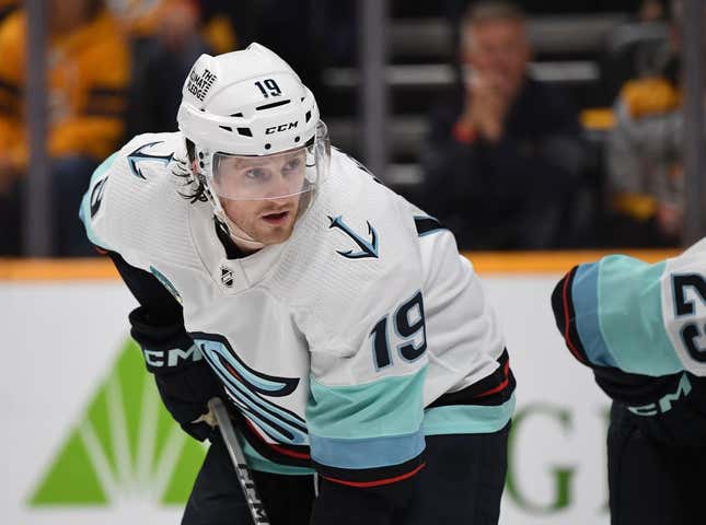 Oct 12, 2023; Nashville, Tennessee, USA; Seattle Kraken left wing Jared McCann (19) waits for a face off during the first period against the Nashville Predators at Bridgestone Arena.