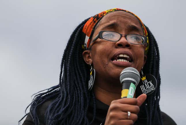 Boston - January 18: Monica Cannon-Grant, founder of Violence In Boston, speaks to a crowd who gathered on MLK Day outside of Madison Park Vocational High School in Boston on Jan. 18, 2021.The rally, organized by Cannon-Grant, was intended to send a message about the inequitable response of police to the riot at the capitol and the treatment of BLM protesters in spring. 