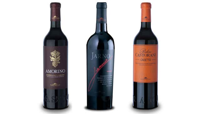 Three bottles of Podere Castorani wine against a white background. 