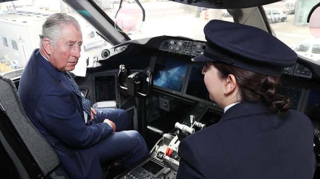 King Charles sits in the cockpit of a British Airways 787 aircraft with a British Airways pilot.