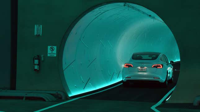 A Tesla car drives through a tunnel in the Central Station during a  media preview of the Las Vegas Convention Center Loop on April 9, 2021, in Las Vegas, Nevada. 