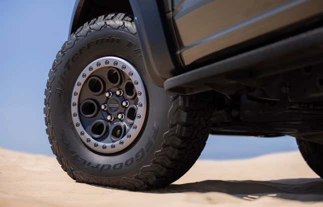 Front wheel of a green 2024 Ford F-150 Raptor R