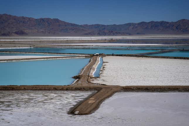 FILE - A truck is parked between brine evaporation ponds at Albemarle Corp.&#39;s Silver Peak lithium facility, Oct. 6, 2022, in Silver Peak, Nev. The Energy Department is making a push to strengthen the U.S. battery supply chain, announcing Wednesday, Nov. 15, 2023, up to $3.5 billion for companies that produce batteries and the critical minerals that go into them. (AP Photo/John Locher, File)