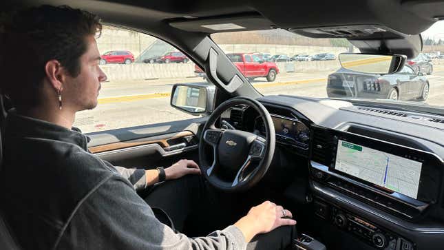 a photo of me driving a chevy truck on the freeway hands free with super cruise 