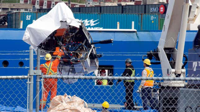 Debris from the Titan submersible, recovered from the ocean floor near the wreck of the Titanic, is unloaded from the ship Horizon Arctic at the Canadian Coast Guard pier in St. John's, Newfoundland, Wednesday, June 28, 2023.