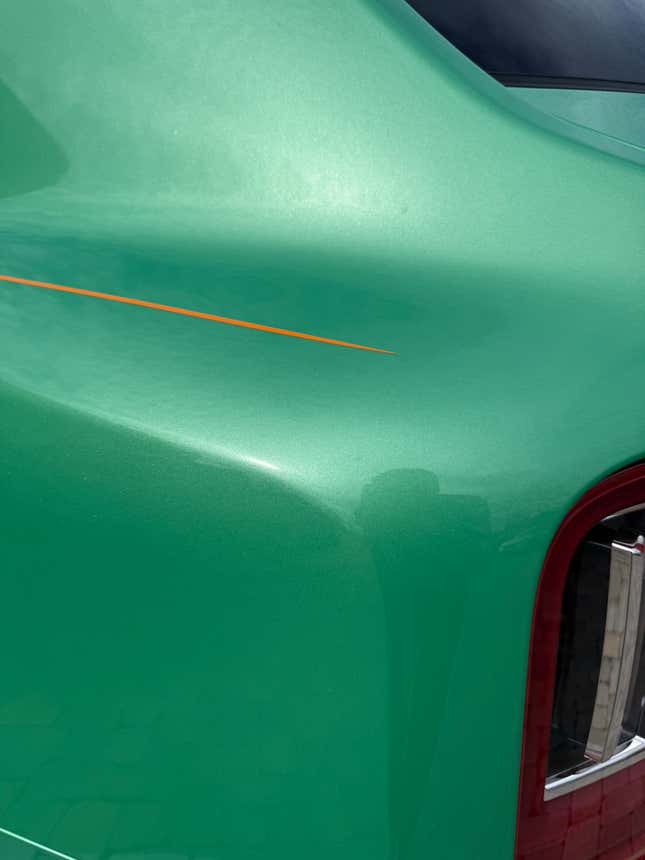 Rear quarter panel of a green Rolls-Royce Cullinan Black Badge