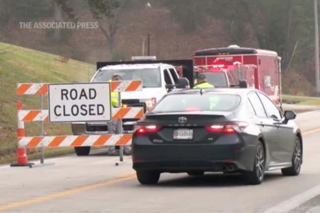 Emergency responders work at the scene of a derailment of a CSX train north of Livingston, Ky., on Wednesday, Nov. 22, 2023. Two of the railcars were carrying molten sulfur and at least one of them was breached, causing a fire that burned until Thursday. (WTVQ via AP Photo.)