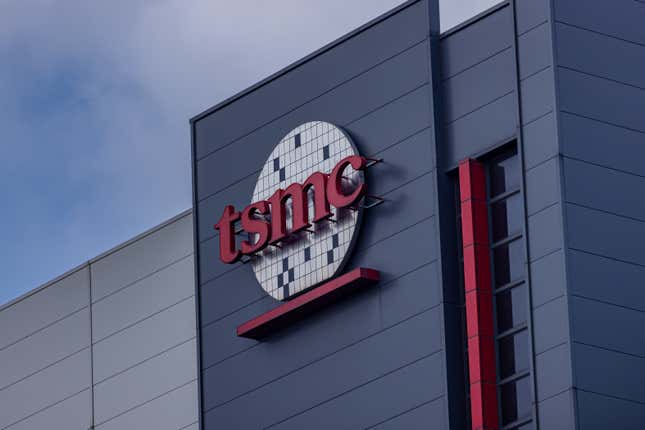 TSMC sign on the front of a gray building