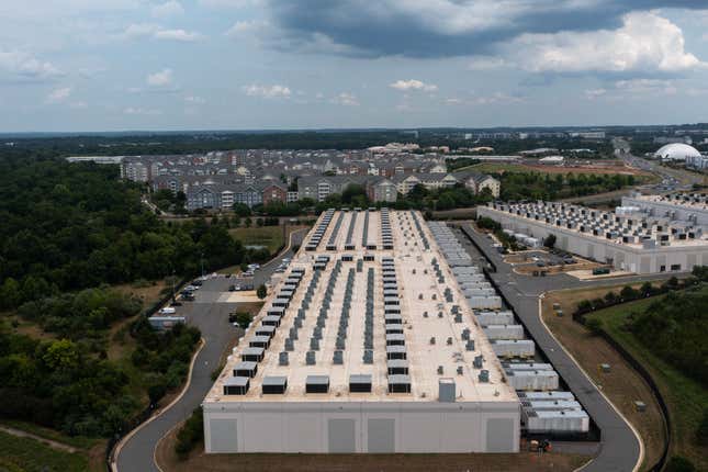 aerial view of a data center with houses in the background