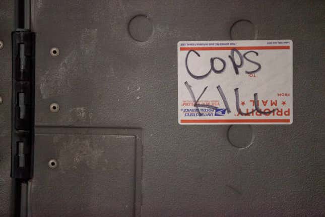 “Cops Kill” is scrawled on a United States Postal Service...LOUISVILLE, KENTUCKY, UNITED STATES - 2020/09/23: “Cops Kill” is scrawled on a United States Postal Service Sticker, and placed on a door outside the Jefferson County Clerk’s office. Kentucky Attorney General Daniel Cameron delivered the verdict from the grand jury responsible for the investigation involving the death of Breonna Taylor. The verdict indicts LMPD Detective Brett Hankison with three counts of wanton endangerment for the gunshots that entered the apartments neighboring Breonna Taylors. The other two officers involved in Breonna Taylors death LMPD officer Myles Cosgrove and officer Jonathan Mattingly were not indicted with any charges related to Breonna Taylors death. 