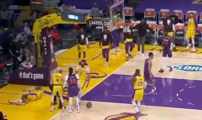 Phoenix Suns guard Devin Booker shoves Los Angeles Lakers guard Dennis Schröder to the ground in the final moments of their Game 3 playoff series. 