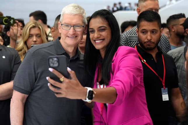 Apple CEO Tim Cook poses for a selfie with Indian badminton player P.V. Sindhu during an announcement of new products on the Apple campus, Tuesday, Sept. 12, 2023, in Cupertino, Calif. (AP Photo/Jeff Chiu)