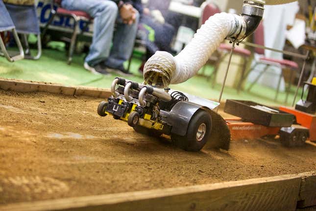 A photo of a remote control tractor competing in the sled pull