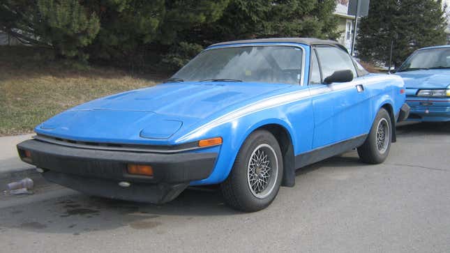 A rather nice Triumph TR7 Convertible with aftermarket alloy wheels.