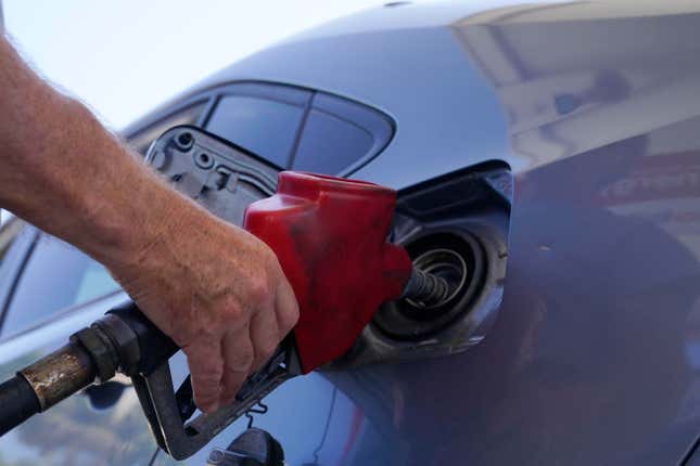 FILE - A customer pumps gas at an Exxon gas station, Tuesday, May 10, 2022, in Miami. Saudi Arabia and Russia agreed Tuesday, Sept. 5, 2023, to extend their voluntary oil production cuts through the end of this year, trimming 1.3 million barrels of crude out of the global market and boosting energy prices. The dual announcements from Riyadh and Moscow pushed benchmark Brent crude above $90 a barrel in trading Tuesday afternoon, a price unseen in the market since last November. (AP Photo/Marta Lavandier, File)