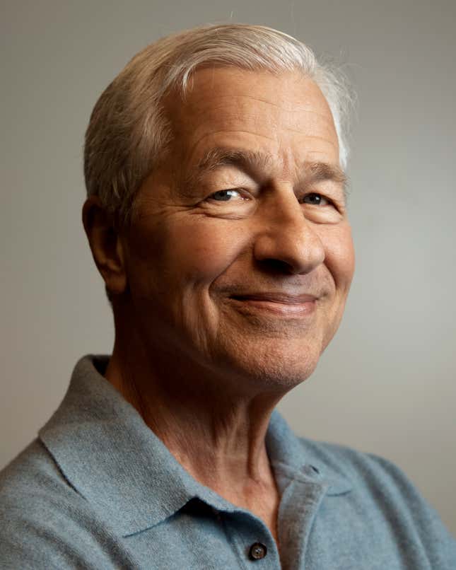 Jamie Dimon, CEO and chairman of JPMorgan Chase, center, poses for a photograph during the community branch opening in the Bronx borough of New York, on Friday, April 26, 2024. (AP Photo/Andres Kudacki)