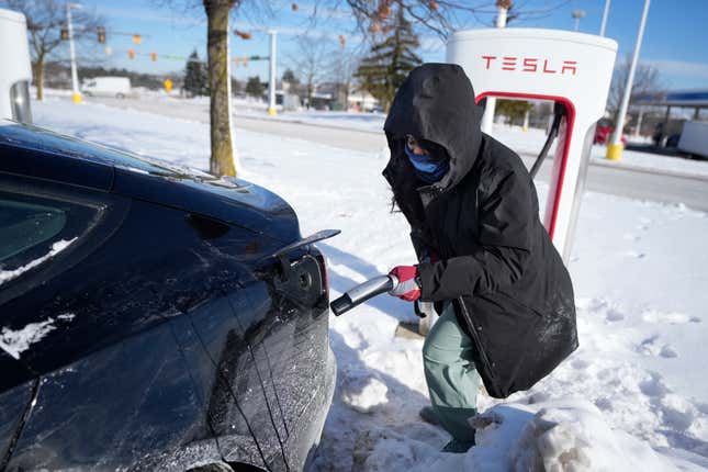 Ankita Bansal prepares to charge her Tesla, Wednesday, Jan. 17, 2024, in Ann Arbor, Mich. A subzero cold snap across the nation has exposed a big vulnerability for electric vehicle owners. It&#39;s difficult to charge the batteries in single-digit temperatures. Experts say it&#39;s simple chemistry, that the electrons move slowly and don&#39;t take in or release as much energy.(AP Photo/Carlos Osorio)