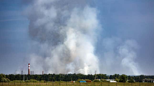 Smoke rises from a forest fire about 18 km (11.3 miles) southeast of Tyumen, western Siberia, Russia, Sunday, June 13, 2021.