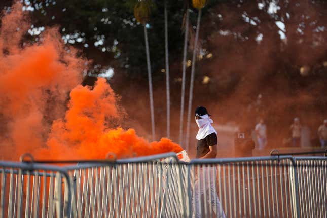 A demonstrator protests against a recently approved mining contract between the government and Canadian mining company First Quantum, outside the National Assembly in Panama City, Monday, Oct. 23, 2023. (AP Photo/Arnulfo Franco)