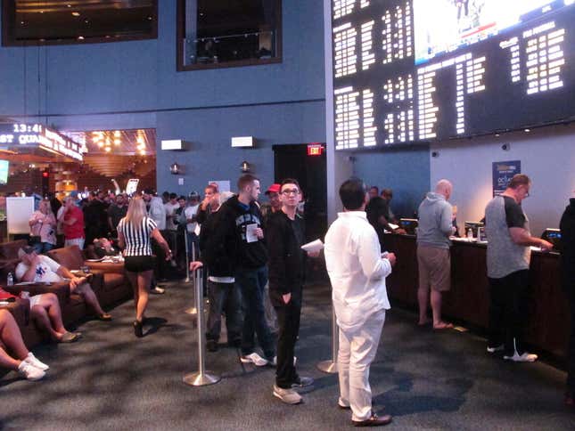 Gamblers line up to make sports bets at the Ocean Casino Resort in Atlantic City, N.J., on Sept. 9, 2018. NFL officials on Tuesday, Jan. 30, 2024, said viewers will only see three sports betting ads during the broadcast of the Super Bowl on Feb. 11. (AP Photo/Wayne Parry)