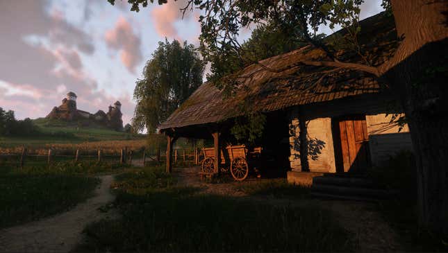 A house in a rural setting with a wooden cart out front and a castle or fort in the distance is seen at what appears to be dusk.