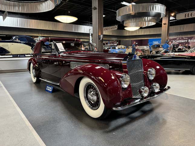 Front 3/4 view of a red 1937 Delage D8-120 Three-Position Cabriolet