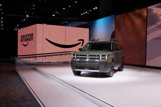 A new Hyundai Santa Fe sitting in front of a massive Amazon box 