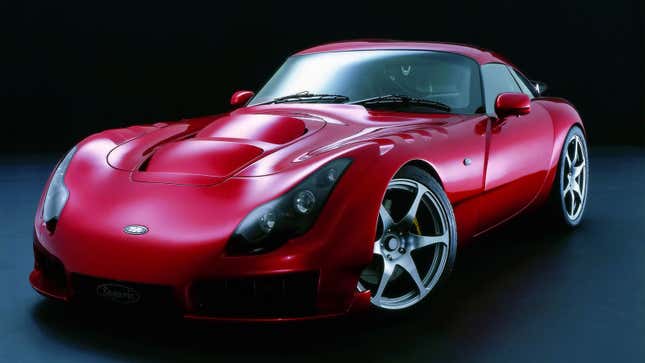 A photo of a red TVR sports car in a studio. 