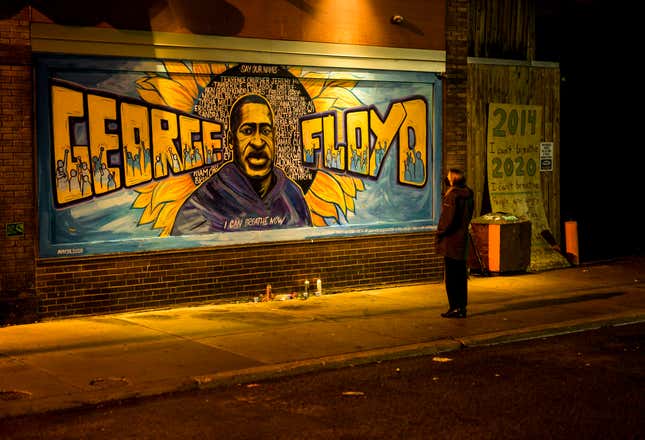 MINNEAPOLIS, MN - MAY 25: A woman looks at a mural on the wall of Cup Foods during a vigil for George Floyd on May 25, 2022 in Minneapolis, Minnesota. It has been two years since George Floyd was killed by Minneapolis Police.