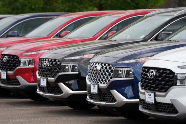 FILE - A line of 2022 Santa Fe SUV&#39;s sit outside a Hyundai dealership on Sept. 12, 2021, in Littleton, Colo. Nearly 3.4 million Hyundai and Kia vehicles in the U.S. are under recall due to the risk of engine compartment fires. (AP Photo/David Zalubowski, File)