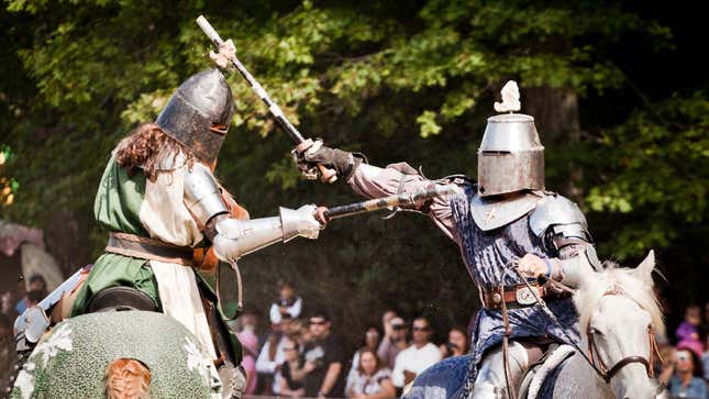 Two knights riding horses at a Renaissance Faire.