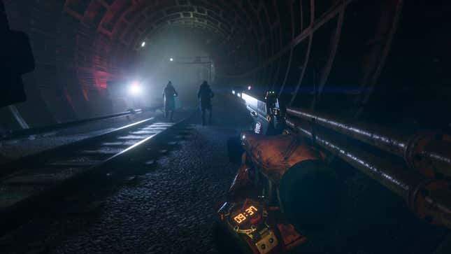 The protagonist stalks a pair of characters in a train tunnel.