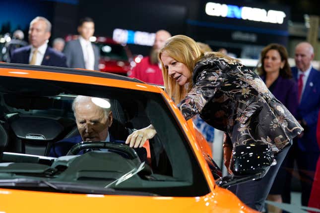 FILE - Mary Barra, CEO of General Motors, talks with President Joe Biden as he sits in a Corvette during a tour of the Detroit Auto Show, Wednesday, Sept. 14, 2022, in Detroit. (AP Photo/Evan Vucci, File)