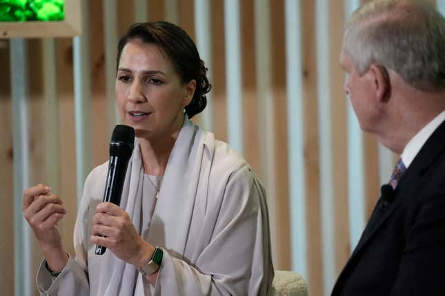 Mariam Almheiri, United Arab Emirates Minister of Climate Change and Environment, left, speaks next to Agriculture Secretary Tom Vilsack at the COP28 U.N. Climate Summit, Friday, Dec. 8, 2023, in Dubai, United Arab Emirates. (AP Photo/Joshua A. Bickel)