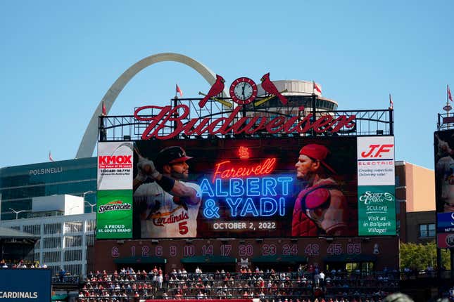 File - a video screen is seen in Busch Stadium as St. Louis Cardinals&#39; Albert Pujols (5) and Yadier Molina (4) are honored during a ceremony before the start of the Cardinals&#39; final regular season baseball game Sunday, Oct. 2, 2022, against the Pittsburgh Pirates in St. Louis. The Cardinals and the world’s leading brewer, Anheuser-Busch, announced, Wednesday, Dec. 13, 2023 that the two historic St. Louis institutions have agreed to a five-year extension of their long-term marketing agreement through 2030.(AP Photo/Jeff Roberson, File)