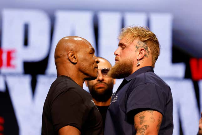 Mike Tyson and Jake Paul speak onstage at the press conference in promotion for the upcoming Jake Paul vs. Mike Tyson boxing match at The Apollo Theater on May 13, 2024 in New York City.