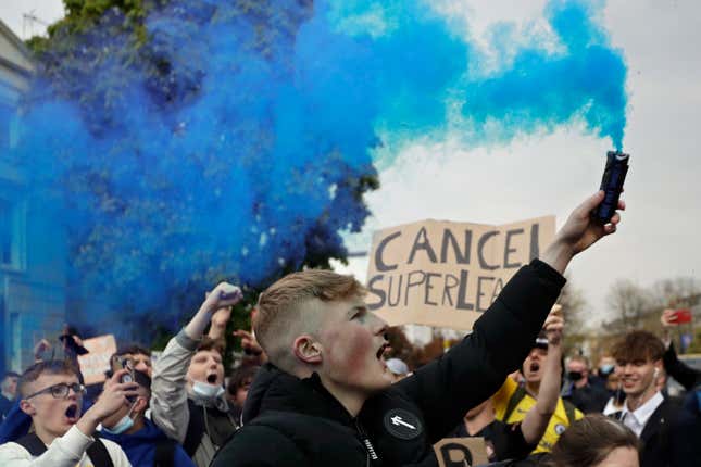 FILE - Chelsea fans protest outside Stamford Bridge stadium in London, against Chelsea&#39;s then decision to be included amongst the clubs attempting to form a new European Super League, Tuesday, April 20, 2021. The European Union’s top court has ruled UEFA and FIFA acted contrary to competition law by blocking plans for the breakaway Super League. The case was heard last year at the Court of Justice after Super League failed at launch in April 2021. UEFA President Aleksander Ceferin called the club leaders “snakes” and “liars.” (AP Photo/Matt Dunham, File)