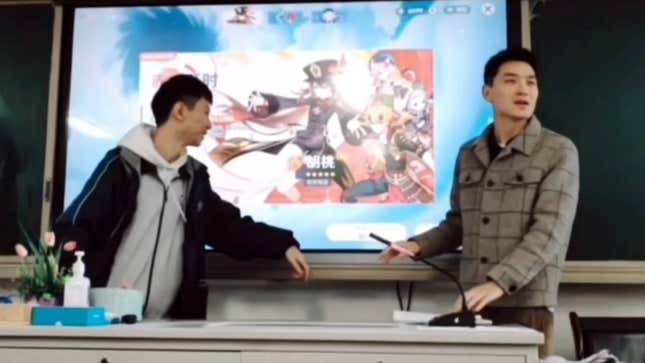 A Genshin Impact player stands with his professor in front of a projector screen with a Hu Tao banner up.