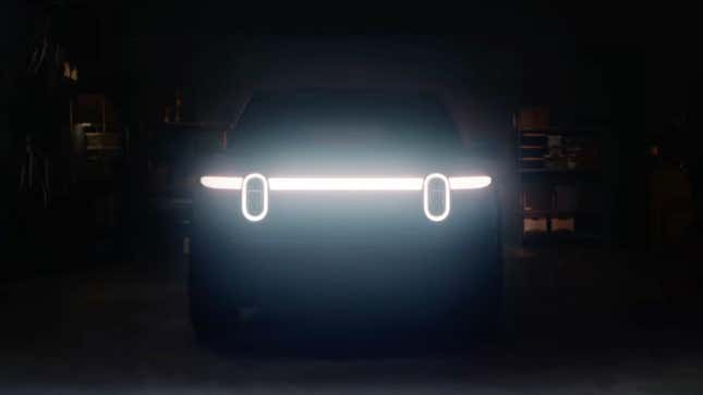 Teaser image showing the Rivian R2's headlights