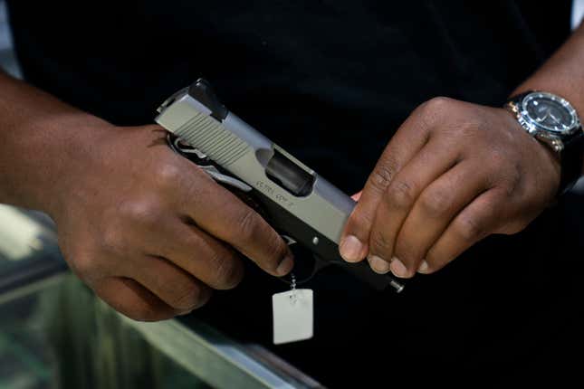 Sales associate Elsworth Andrews shows a handgun to a customer at Burbank Ammo &amp; Guns in Burbank, Calif., Thursday, June 23, 2022. The Supreme Court has ruled that Americans have a right to carry firearms in public for self-defense, a major expansion of gun rights. The court struck down a New York gun law in a ruling expected to directly impact half a dozen other populous states.