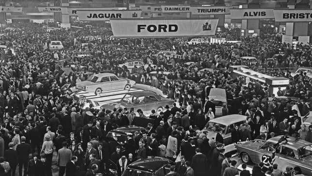 A black and white photo of the London Auto Show. 