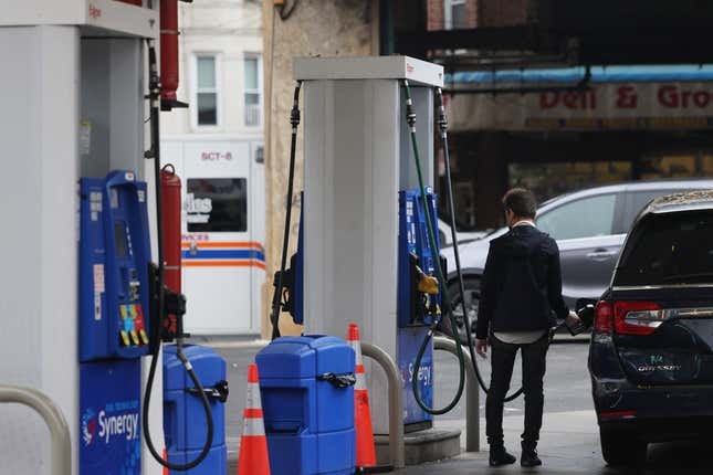  A person pumps gas at an Exxon gas station on October 06, 2023 in the Brooklyn borough of New York City