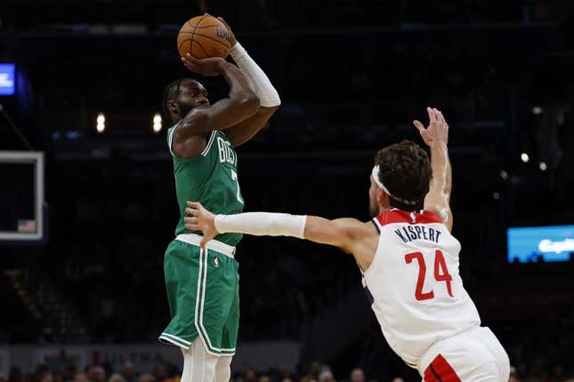 Oct 30, 2023; Washington, District of Columbia, USA; Boston Celtics guard Jaylen Brown (7) shoots the ball over Washington Wizards forward Corey Kispert (24) in the second quarter at Capital One Arena.