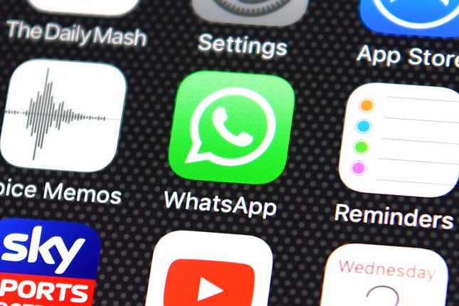 Whatsapp app logo is displayed on an iPhone