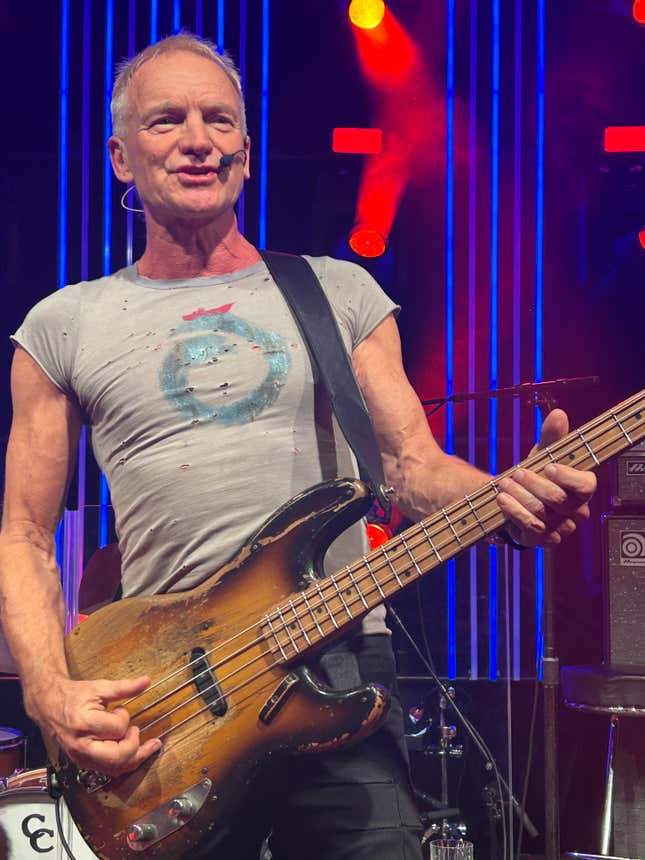 Sting plays the bass at a show