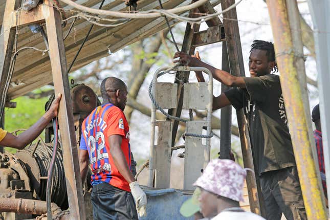 An artisanal miner assists in the rescue mission of trapped miners in Chegutu, about 100 kilometers (60 miles) west of the capital Harare, Saturday, Sept. 30 2023. Several people have died from the collapse of a gold mine in Zimbabwe, according to state media reports. (AP Photo)