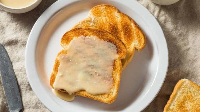 Maple cream spread on toast on white plate