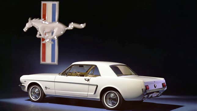 A photo of a white 1964 Ford Mustang. 